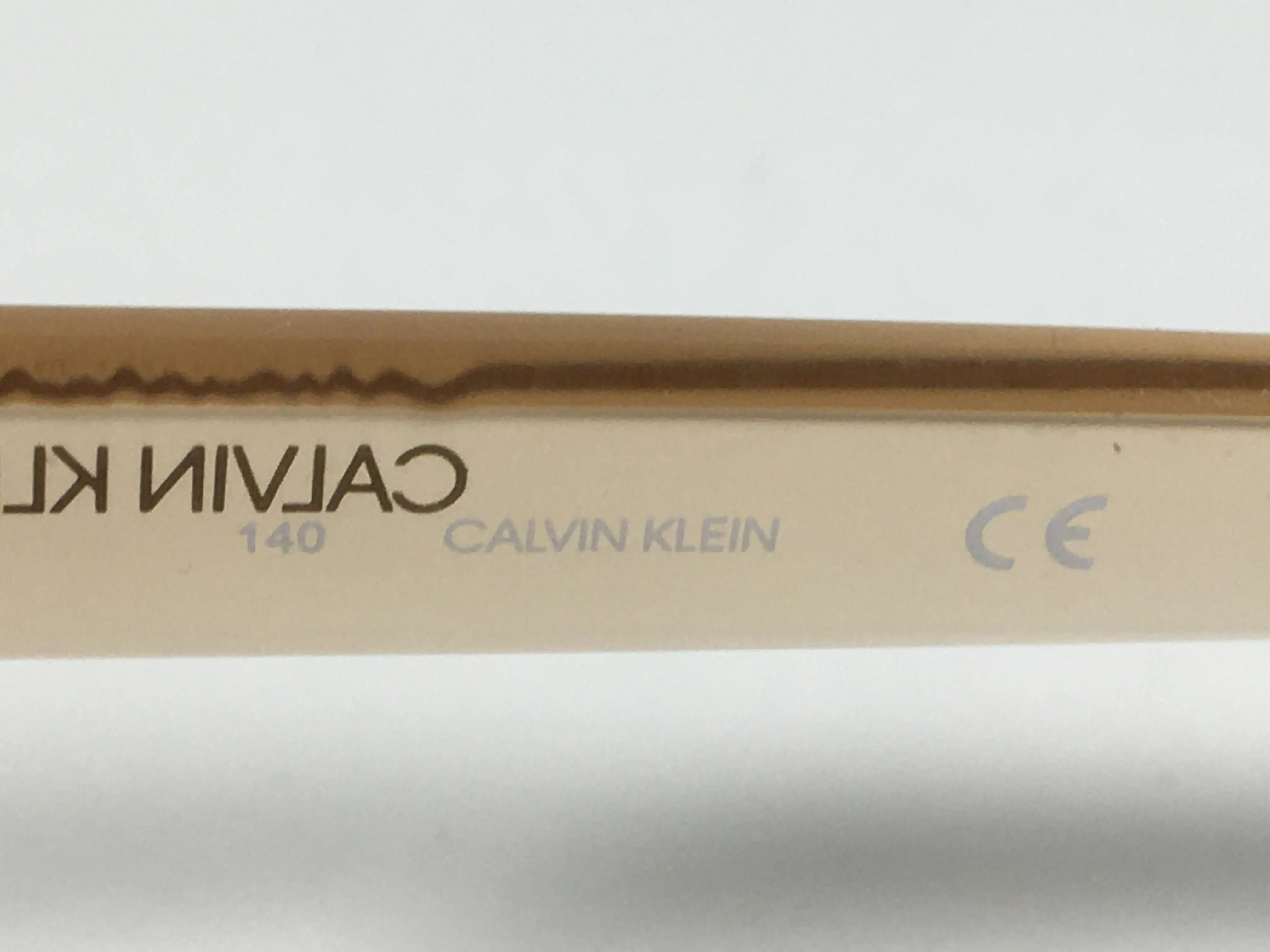 Calvin Klein Oval Sunglasses CK19541S 270 Light Brown Crystal Frame Brown Gradient Lens