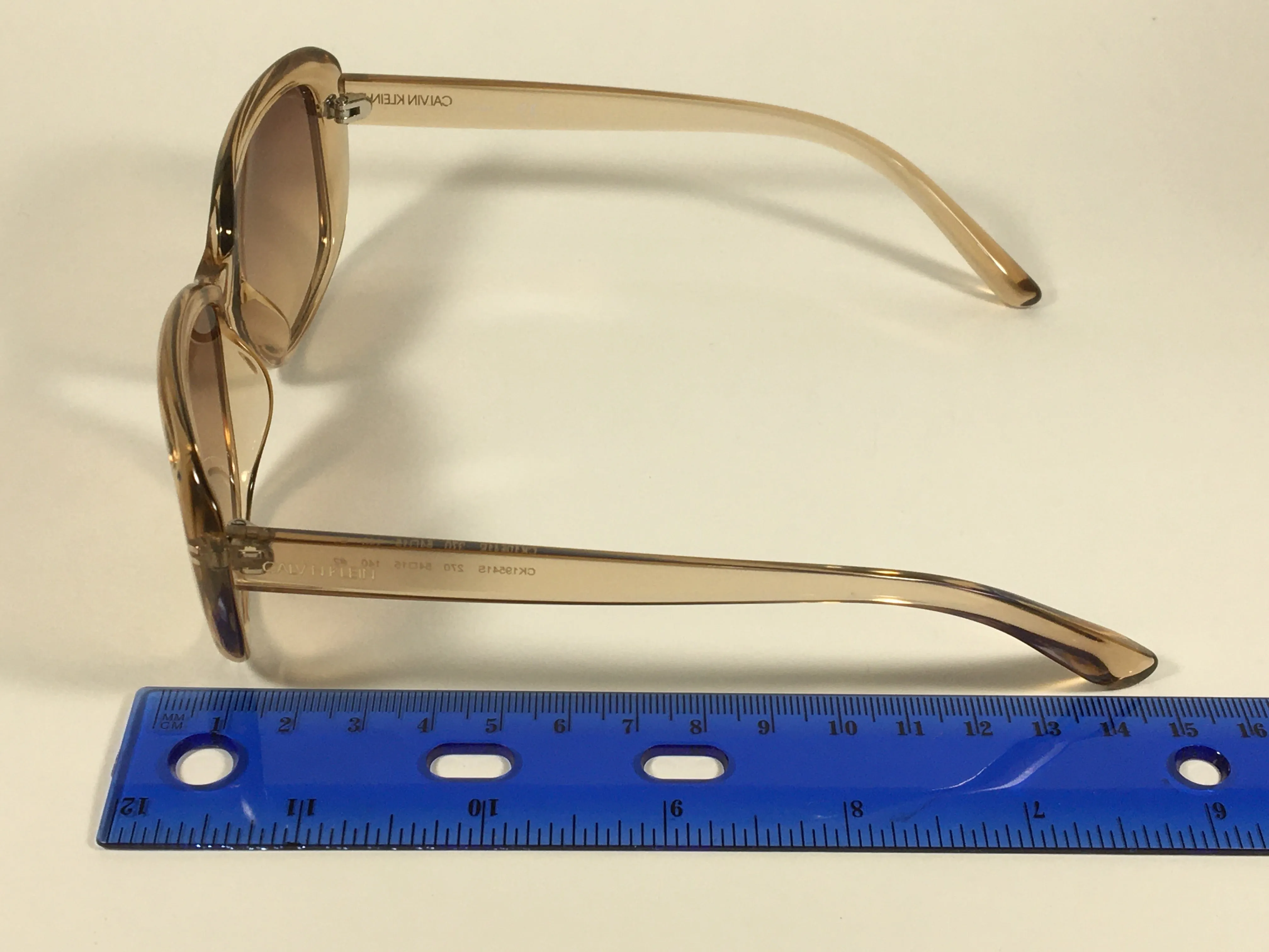 Calvin Klein Oval Sunglasses CK19541S 270 Light Brown Crystal Frame Brown Gradient Lens