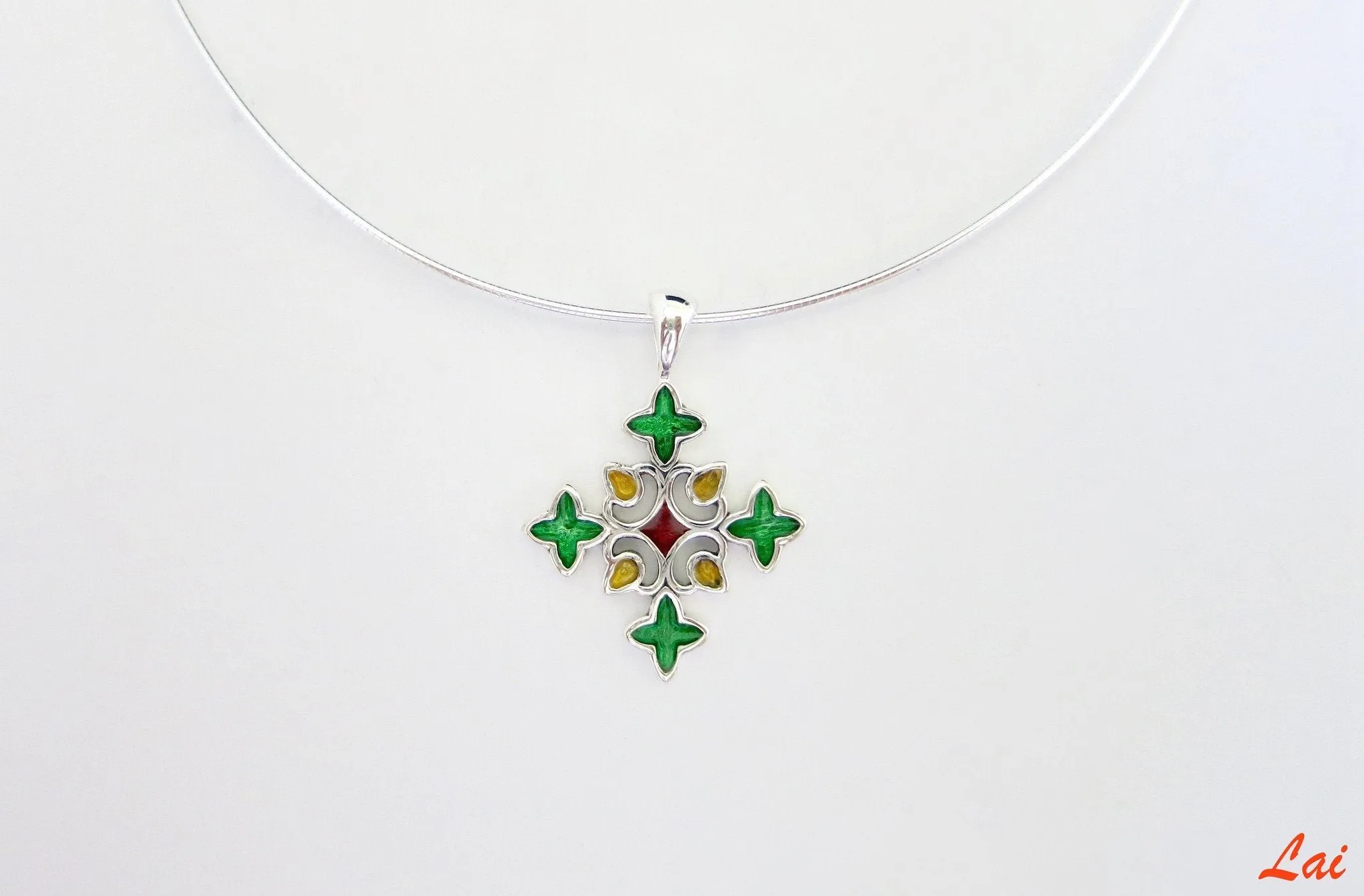 Chic and fun, rangoli-inspired, cross shape enamel pendant