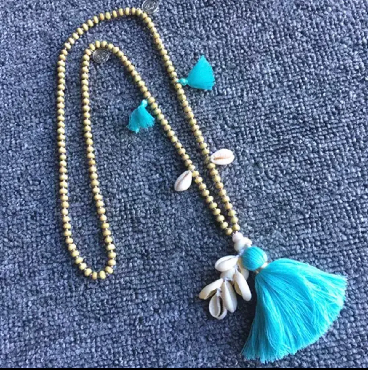Wooden Beads Necklace with Cowry Shells and Cotton Tassels | Erika Williner Designs