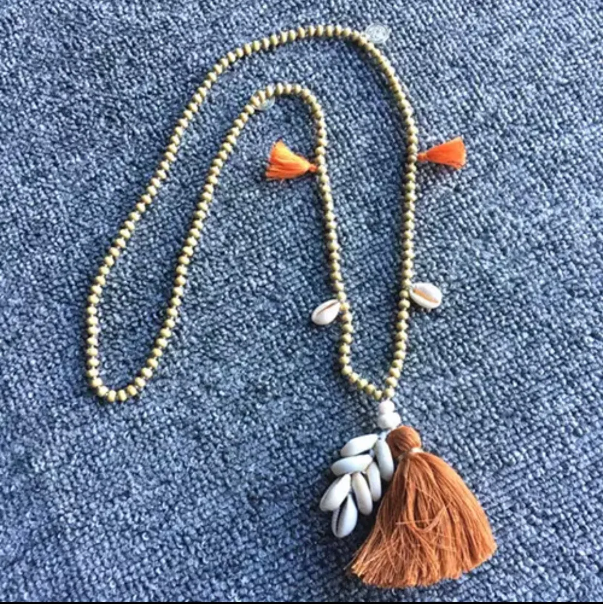 Wooden Beads Necklace with Cowry Shells and Cotton Tassels | Erika Williner Designs