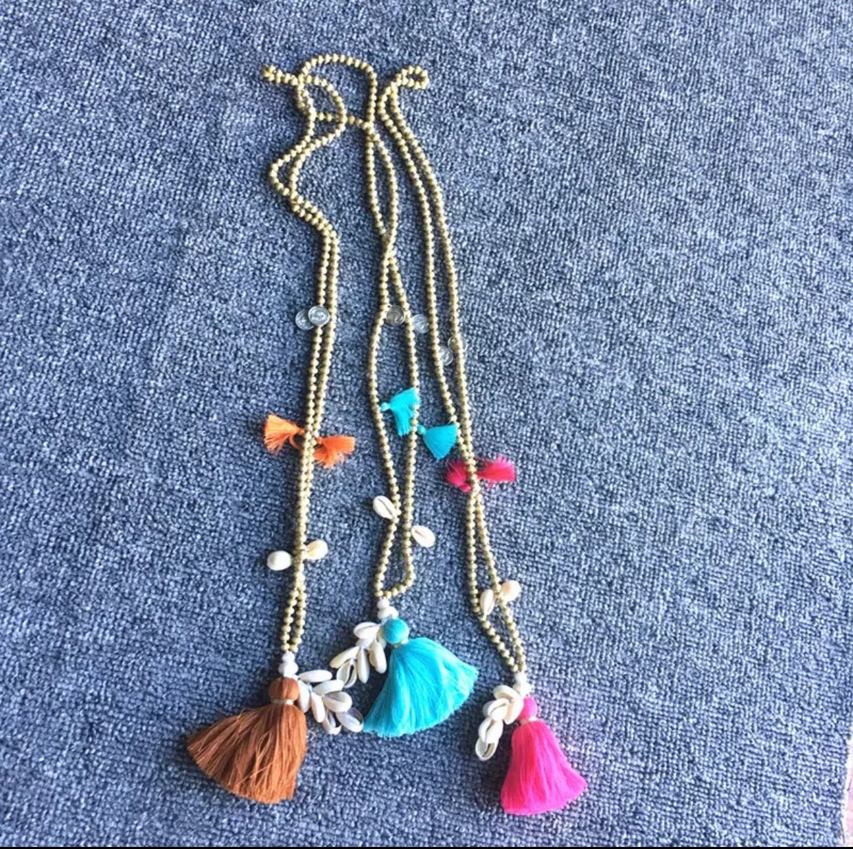 Wooden Beads Necklace with Cowry Shells and Cotton Tassels | Erika Williner Designs